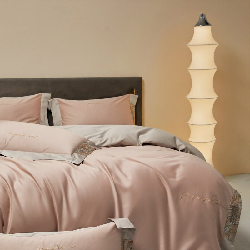 VILZSTUDIOS two-tone satin bedding set with broad contrasting borders and script embroidery