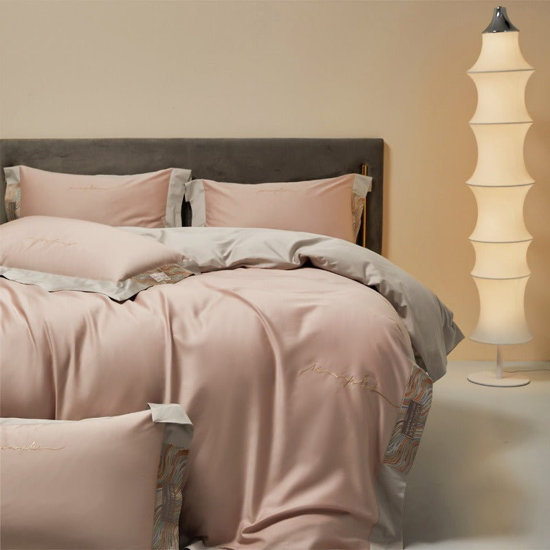 VILZSTUDIOS two-tone satin bedding set with broad contrasting borders and script embroidery