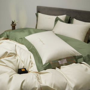 VILZSTUDIOS two-tone satin bedding set with broad contrasting borders and script embroidery