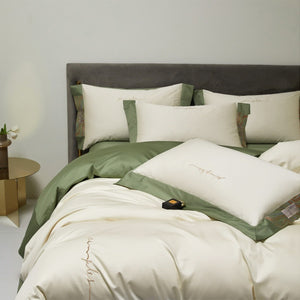 VILZSTUDIOS two-tone satin bedding set with broad contrasting borders and script embroidery