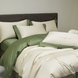 VILZSTUDIOS two-tone satin bedding set with broad contrasting borders and script embroidery