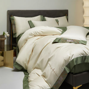 VILZSTUDIOS two-tone satin bedding set with broad contrasting borders and script embroidery