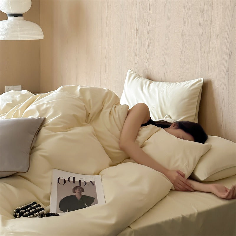VILZSTUDIOS Neutral and pastel solid-color bedding set with contrast piping on the duvet cover and matching pillowcases