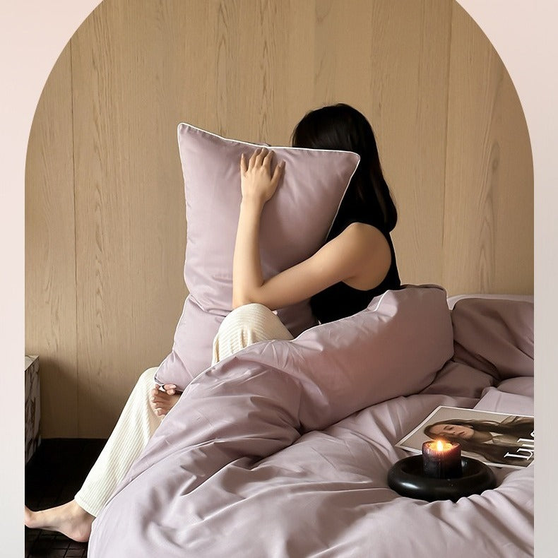 VILZSTUDIOS Neutral and pastel solid-color bedding set with contrast piping on the duvet cover and matching pillowcases