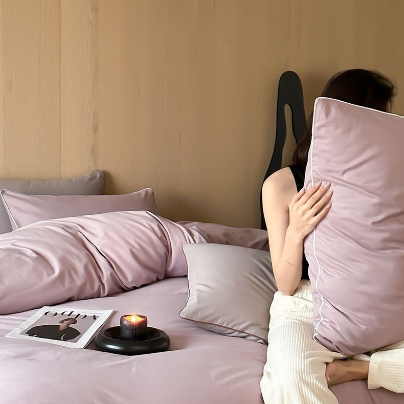 VILZSTUDIOS Neutral and pastel solid-color bedding set with contrast piping on the duvet cover and matching pillowcases