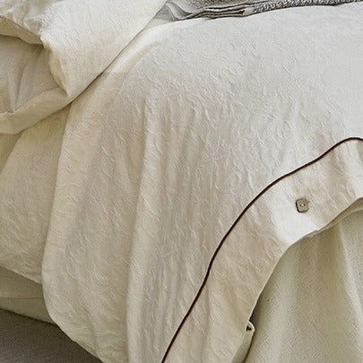 VILZSTUDIOS cream floral damask linen bedding set with dark piping and square buttons