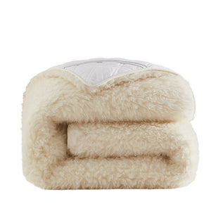 VILZSTUDIOS cream-white wool mattress pad with fluffy pile and diamond-quilted reverse