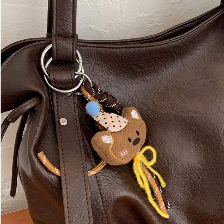 VILZSTUDIOS soft faux leather slouchy tote bag with embroidery charm