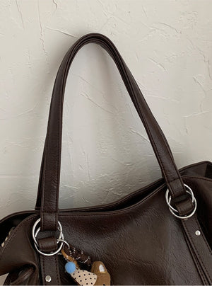 VILZSTUDIOS soft faux leather slouchy tote bag with embroidery charm