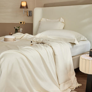 VILZSTUDIOS solid-color satin duvet cover set with matching wide flanged pillowcases and a flat sheet