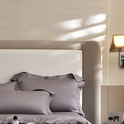 VILZSTUDIOS solid-color satin duvet cover set with matching wide flanged pillowcases and a flat sheet