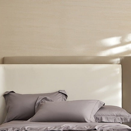 VILZSTUDIOS solid-color satin duvet cover set with matching wide flanged pillowcases and a flat sheet