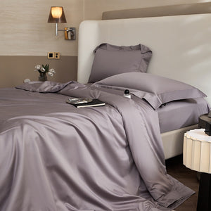 VILZSTUDIOS solid-color satin duvet cover set with matching wide flanged pillowcases and a flat sheet