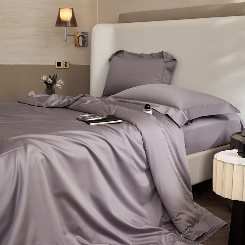 VILZSTUDIOS solid-color satin duvet cover set with matching wide flanged pillowcases and a flat sheet