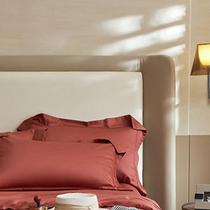 VILZSTUDIOS solid-color satin duvet cover set with matching wide flanged pillowcases and a flat sheet