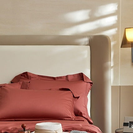 VILZSTUDIOS solid-color satin duvet cover set with matching wide flanged pillowcases and a flat sheet