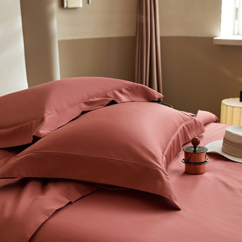VILZSTUDIOS solid-color satin duvet cover set with matching wide flanged pillowcases and a flat sheet