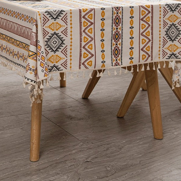 VILZSTUDIOS earthy, black-and-white or orange-yellow geometric stripe tablecloth with knotted tassel fringe
