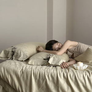 VILZSTUDIOS pale champagne botanical jacquard duvet cover set with embroidered branches and dark green pillowcase bows