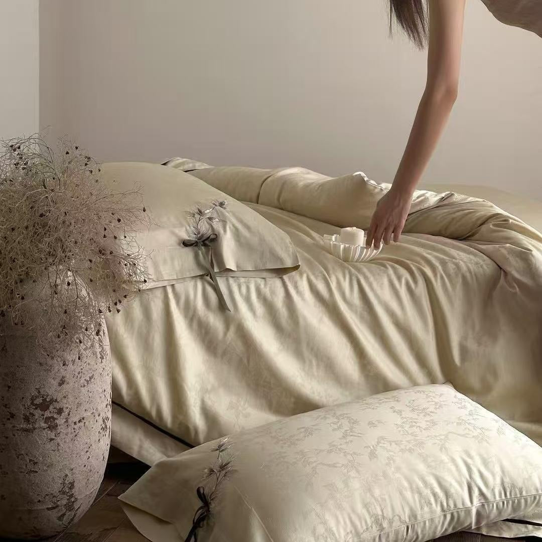 VILZSTUDIOS pale champagne botanical jacquard duvet cover set with embroidered branches and dark green pillowcase bows