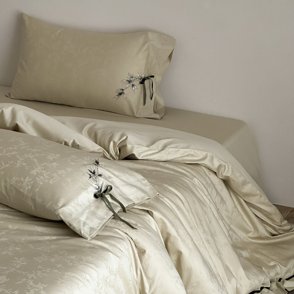 VILZSTUDIOS pale champagne botanical jacquard duvet cover set with embroidered branches and dark green pillowcase bows