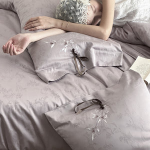 VILZSTUDIOS pale champagne botanical jacquard duvet cover set with embroidered branches and dark green pillowcase bows