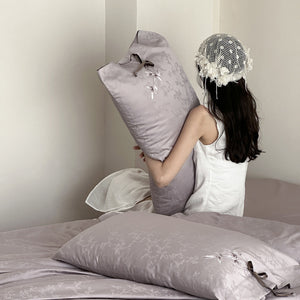 VILZSTUDIOS pale champagne botanical jacquard duvet cover set with embroidered branches and dark green pillowcase bows