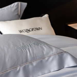 VILZSTUDIOS solid-color satin duvet cover set with wide flanged borders and delicate hemstitch trim
