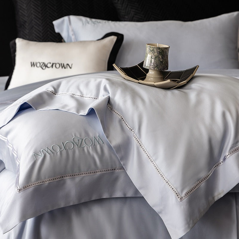 VILZSTUDIOS solid-color satin duvet cover set with wide flanged borders and delicate hemstitch trim