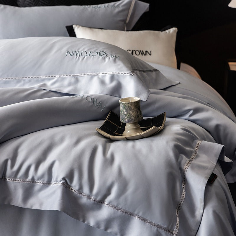 VILZSTUDIOS solid-color satin duvet cover set with wide flanged borders and delicate hemstitch trim