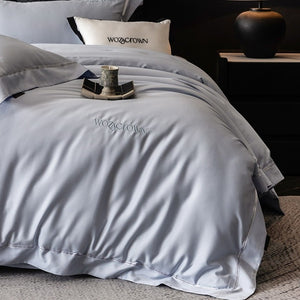VILZSTUDIOS solid-color satin duvet cover set with wide flanged borders and delicate hemstitch trim