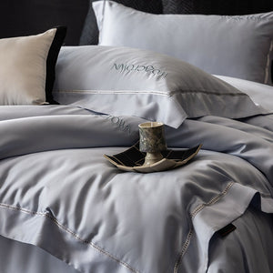 VILZSTUDIOS solid-color satin duvet cover set with wide flanged borders and delicate hemstitch trim