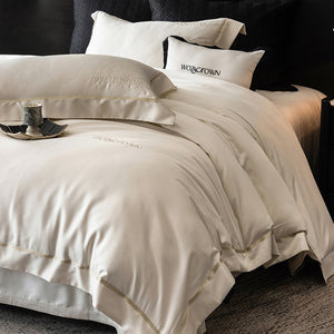 VILZSTUDIOS solid-color satin duvet cover set with wide flanged borders and delicate hemstitch trim