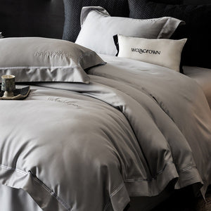 VILZSTUDIOS solid-color satin duvet cover set with wide flanged borders and delicate hemstitch trim