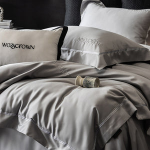 VILZSTUDIOS solid-color satin duvet cover set with wide flanged borders and delicate hemstitch trim