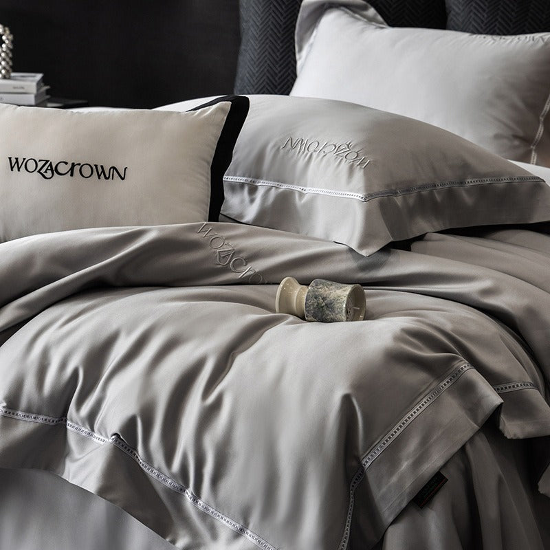 VILZSTUDIOS solid-color satin duvet cover set with wide flanged borders and delicate hemstitch trim