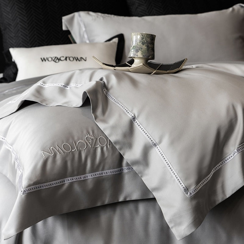 VILZSTUDIOS solid-color satin duvet cover set with wide flanged borders and delicate hemstitch trim