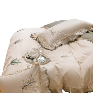 VILZSTUDIOS cream and sage green bedding set with lily-of-the-valley embroidery, lace detailing and layered ruffle trims