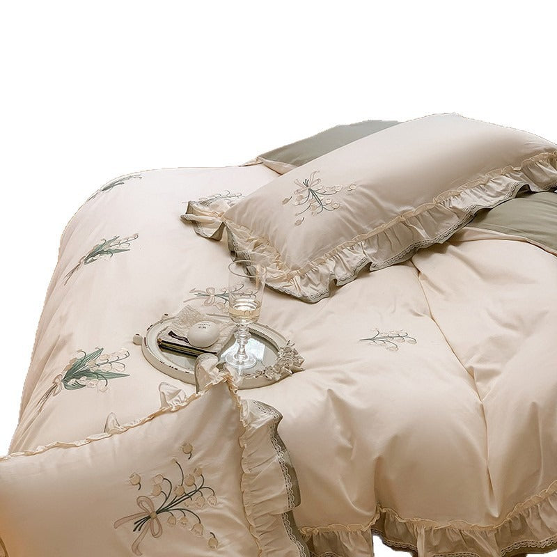 VILZSTUDIOS cream and sage green bedding set with lily-of-the-valley embroidery, lace detailing and layered ruffle trims