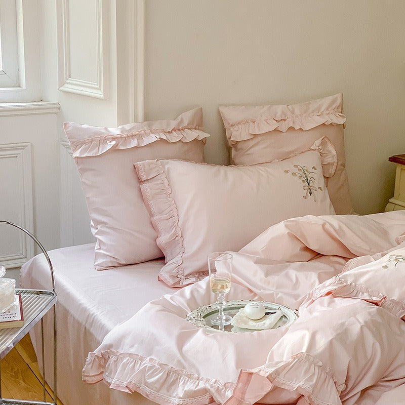 VILZSTUDIOS cream and sage green bedding set with lily-of-the-valley embroidery, lace detailing and layered ruffle trims