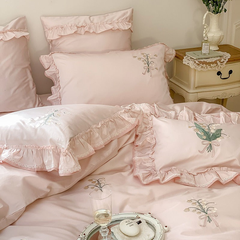 VILZSTUDIOS cream and sage green bedding set with lily-of-the-valley embroidery, lace detailing and layered ruffle trims