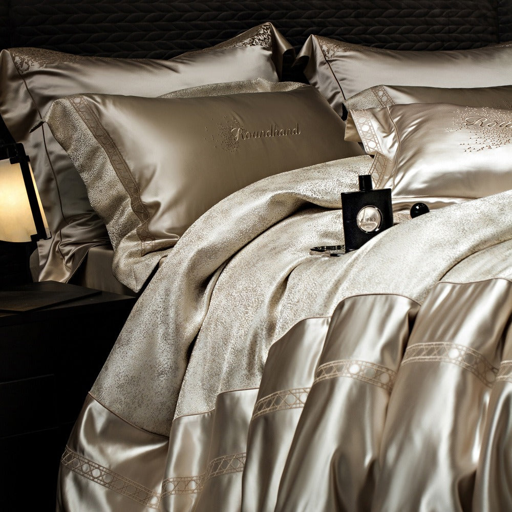 VILZSTUDIOS champagne gold satin duvet cover set with metallic-flecked center panel and geometric embroidered trim