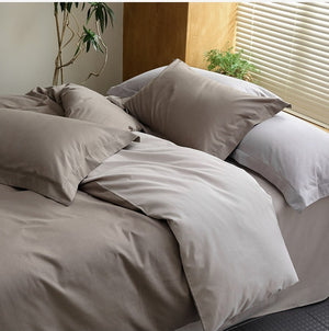 VILZSTUDIOS muted two-tone duvet cover set with contrasting reverse and flanged pillowcases
