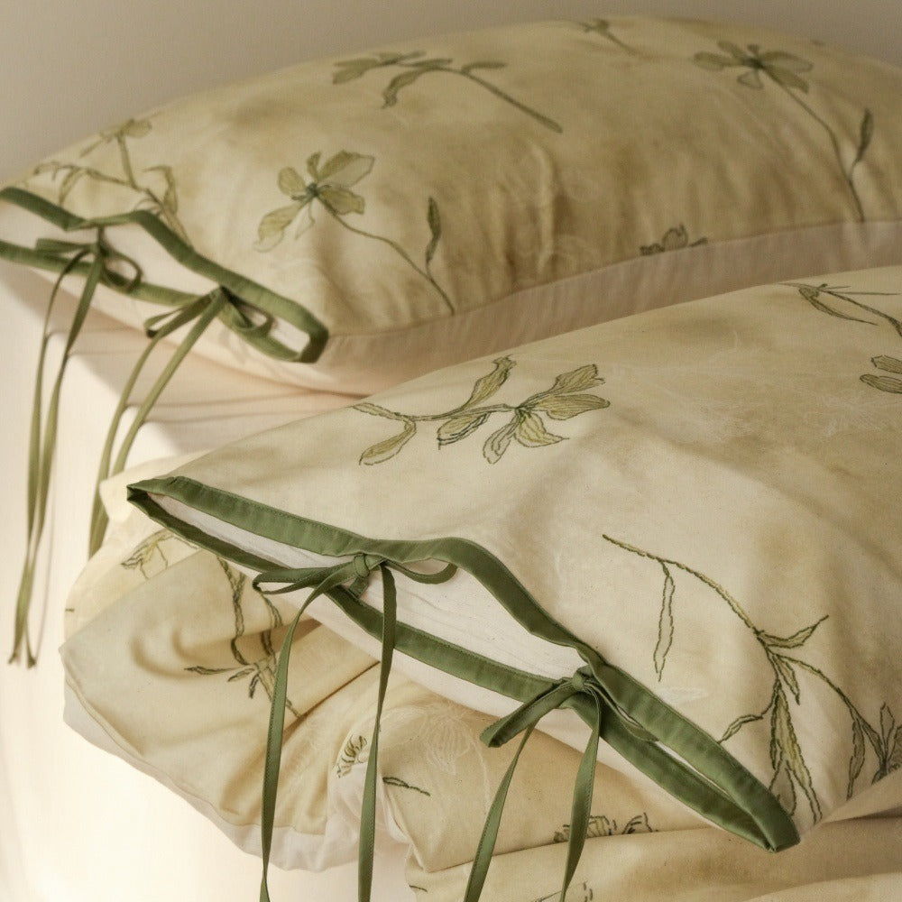 VILZSTUDIOS cream-yellow botanical duvet cover set with olive floral stems and ribbon-tie pillowcases