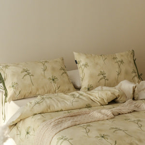 VILZSTUDIOS cream-yellow botanical duvet cover set with olive floral stems and ribbon-tie pillowcases