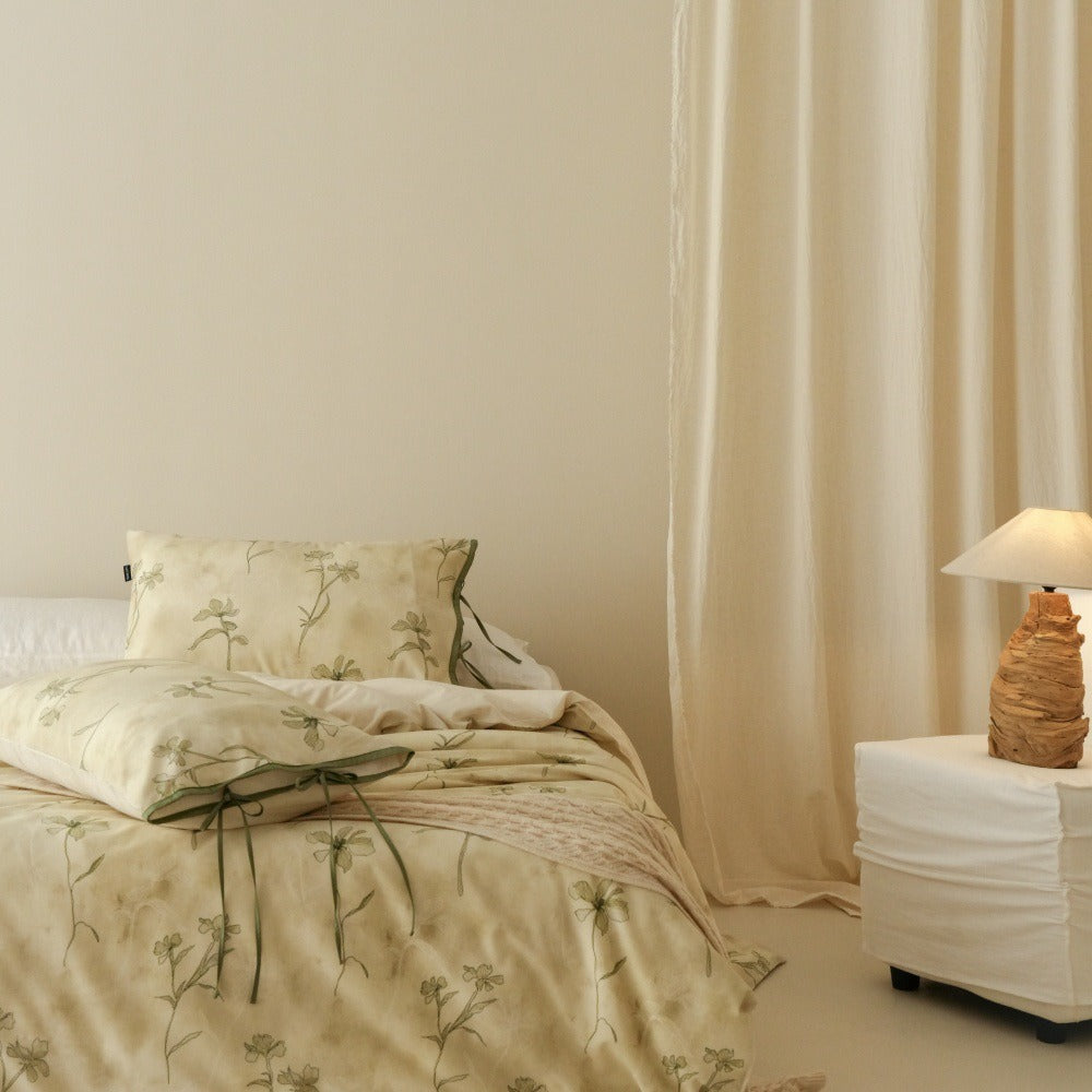 VILZSTUDIOS cream-yellow botanical duvet cover set with olive floral stems and ribbon-tie pillowcases