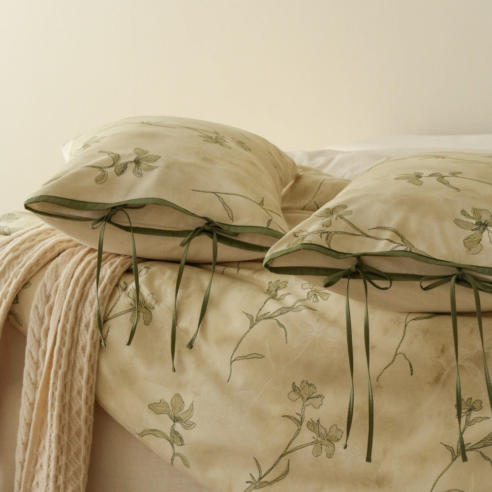 VILZSTUDIOS cream-yellow botanical duvet cover set with olive floral stems and ribbon-tie pillowcases