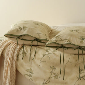 VILZSTUDIOS cream-yellow botanical duvet cover set with olive floral stems and ribbon-tie pillowcases