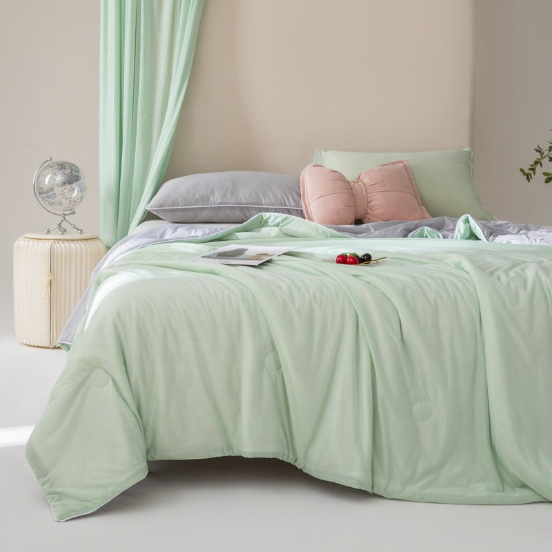 VILZSTUDIOS pastel two-tone summer quilt with circular quilting and piped edges