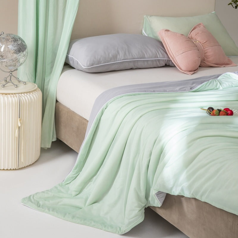VILZSTUDIOS pastel two-tone summer quilt with circular quilting and piped edges